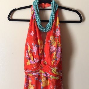 Orange floral, 100% silk. Solid orange silk lined.